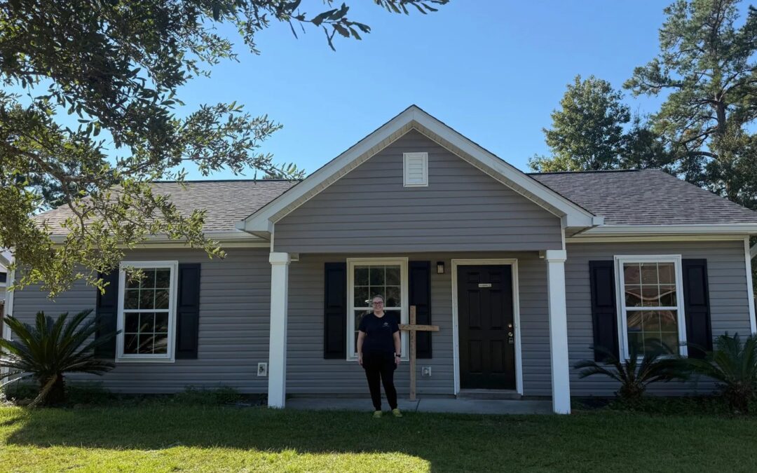 Alexis standing in front of her future Habitat home on Wilson Drive in Summerville